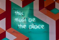 Neon sign with the text "This must be the place"